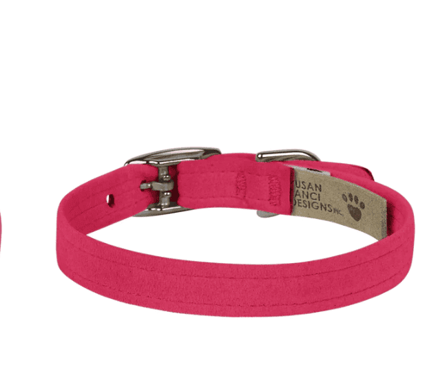 A dog collar in vibrant pink color with metal buckle and adjustable strap, designed for pet comfort and style.